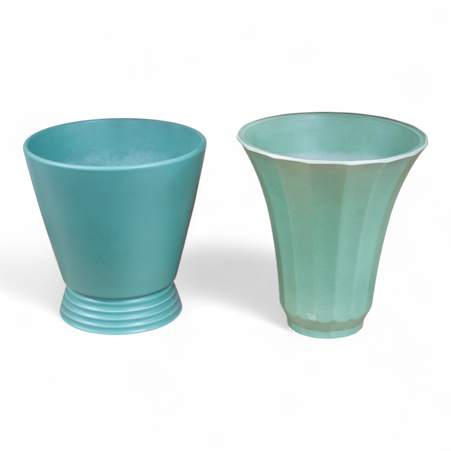 Keith Murray for Wedgwood, two green vases comprising a tapering, fluted example and one with stepped foot, largest 18cm high